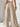 Beige wide-leg pants with high waist, back view