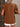 Brown blouse with ruffled sleeves worn by a person against a neutral background