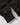 Cuffed ankle detail of black joggers with smooth finish