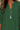 Green blouse worn by a person with a silver necklace
