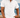 Man wearing a white short-sleeve shirt by the ocean