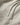 Metal-tipped drawstrings on soft beige cotton-blend fabric