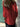 Person wearing a red jacket with a blurred background
