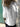 Person wearing a white shirt with a blurred background