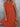 Person wearing an orange dress holding a wooden clutch against a gray background