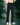 Person wearing black drawstring pants with side pockets and elastic waistband, styled with sneakers with background