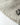 Raw edge hem with streetwear-style graphic text on beige cotton pants