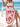 Woman in a beige and pink boho maxi dress on a beach