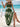 Woman in a green boho dress with white patterns sitting on a swing by the beach