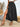 A black skirt with a high slit