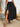 A black tiered skirt with slit