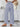 A blue and white striped pants, back view