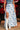 A blue floral skirt with a high slit