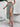 A green floral skirt with slit