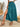 A teal skirt with a high slit