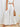 A white outfit with wide-leg pants