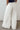 A white wide-leg pants, back view