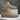 Beige suede Chelsea boots on a gray background