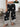 Black pants with white patterns, front view