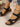 Black sandals with wooden-look soles