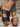 Black slip-ons, side view