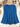 Blue blouse on a wooden hanger with floral decorations in the background