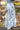 Blue floral skirt with a high slit, front view
