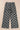 Checkered pants on a beige background