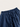 Close-up of blue pants with an elastic waistband on a light background