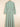 Green and white striped dress on a beige background