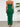 Green strapless dress with a slit on a plain background