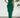 Green strapless ruffled dress worn by a model against a white wall with a plant