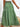 Green tiered skirt worn by a woman, back view