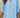 Light blue blouse worn by a person with a neutral background