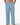 Light blue linen trouser pants worn by a person on a white background