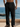 Lightweight black linen-blend pants for men with side button detailing and relaxed beach-ready fit