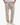 Man wearing khaki textured drawstring pants with relaxed fit and hands in pockets, paired with white sneakers 