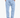 Man wearing light blue textured drawstring pants with relaxed fit and hands in pockets, paired with white sneakers