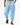 Man wearing loose light blue drawstring pants with side pockets and sandals while walking on white background