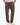 Man wearing taupe textured drawstring pants with relaxed fit and hands in pockets, paired with white sneakers 