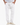 Man wearing white textured drawstring pants with relaxed fit and hands in pockets, paired with white sneakers 