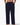 Navy blue pajama pants worn by a person on a white background