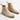 Pair of beige Chelsea boots on a light gray background