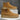 Pair of tan suede boots on a gray and white background
