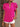 Person wearing a bright pink blouse with ruffled sleeves against a neutral background