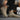 Person wearing beige Chelsea boots with a blurred background