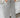Person wearing black and white striped wide-leg pants