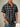 Men's black and grey plaid short sleeve button up shirt with pointed collar – front view