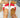 Red and white sandals with brown soles 
