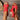 Red sandals with cut-out design held by a person on a wooden floor